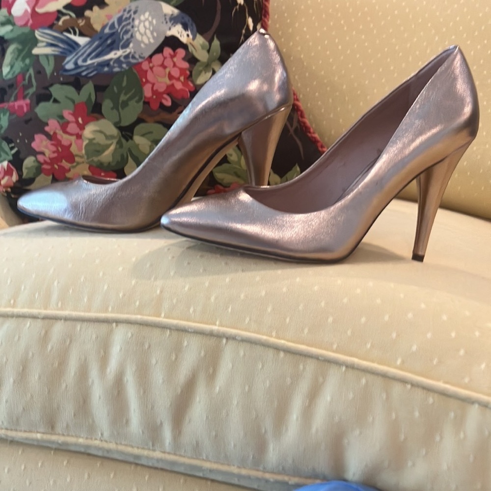 Vince Camuto gold heels size 7 1/2 never worn.Exterior is perfect. $25